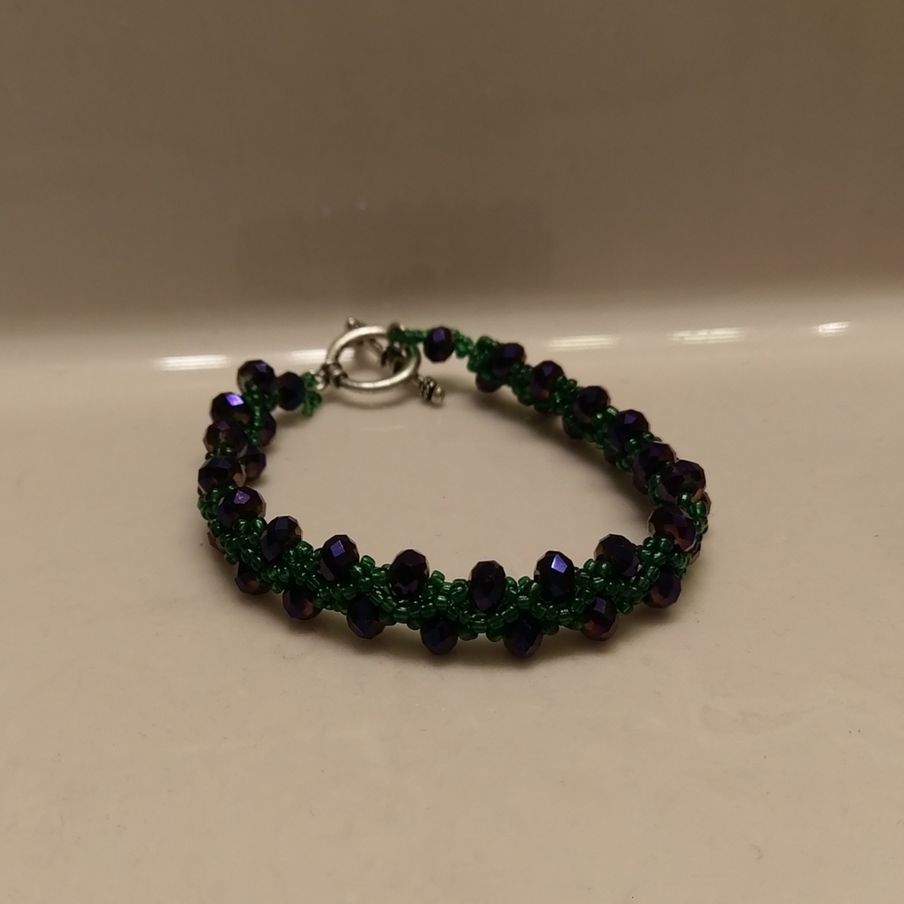 Purple and dark green beaded bracelet